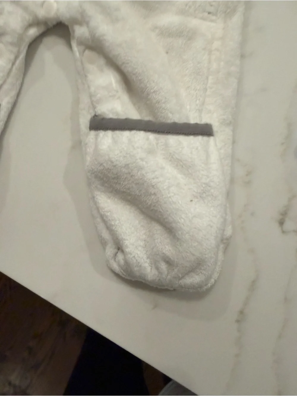 The North Face White Fleece Baby One-Piece with Gray Trim